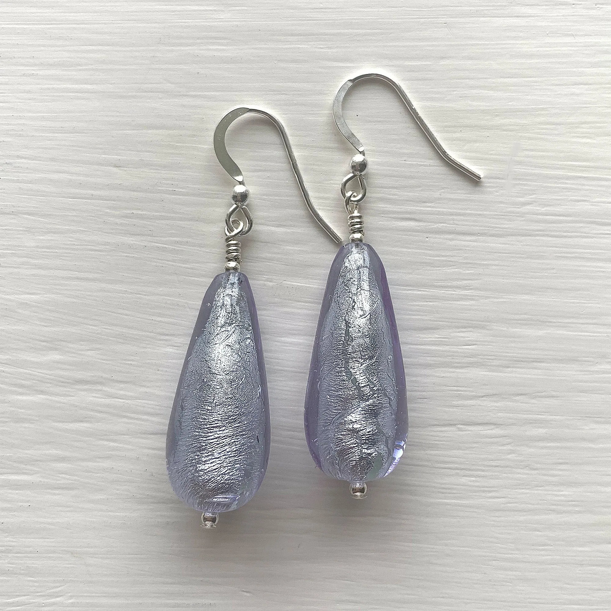 Earrings with lilac (purple) Murano glass long pear drops on silver or gold hooks